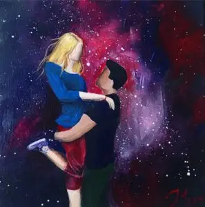 An expressive painting of a couple embracing against a cosmic background filled with swirling purples, reds, and star-like white specks. A man with short dark hair lifts a blonde woman in his arms; she wears a blue top and red shorts, and her purple sneakers are visible. The man is dressed in a dark shirt and green pants. The figures are faceless, emphasizing emotion over detail. The artwork is signed “M 2019” in red in the bottom right corner.