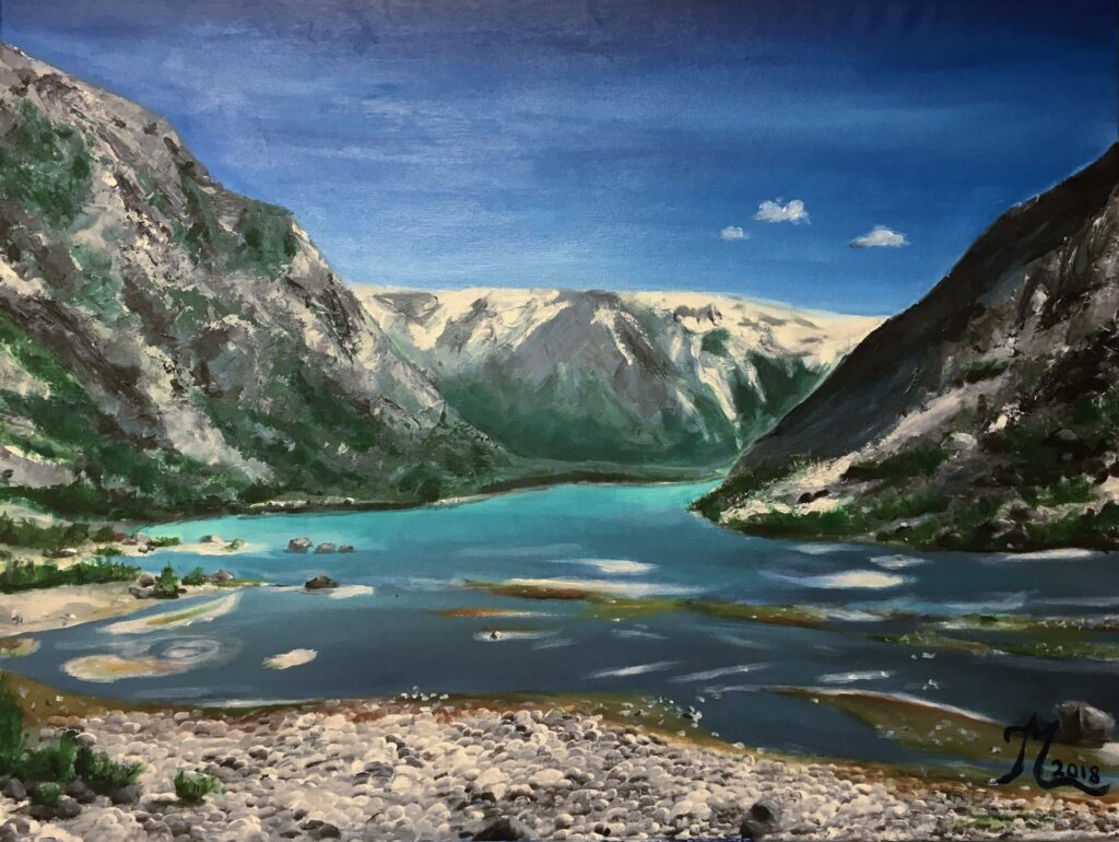 Realistic oil painting of a serene mountain lake surrounded by towering, snow-capped peaks. In the foreground, smooth round stones lead into shallow, reflective water with hints of green and brown aquatic vegetation. The turquoise lake stretches into the distance, framed by steep, rocky mountain slopes on both sides. The sky is a deep blue with a few small white clouds, creating a peaceful, high-altitude atmosphere. The artist’s signature appears in the bottom right corner, dated 2018